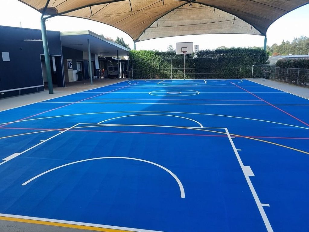 Christian-College-Toongabbie-Sydney-sports-court-surfaced-in-SPORTSCOTE-Sports-Blue-by-Active-Line-Marking